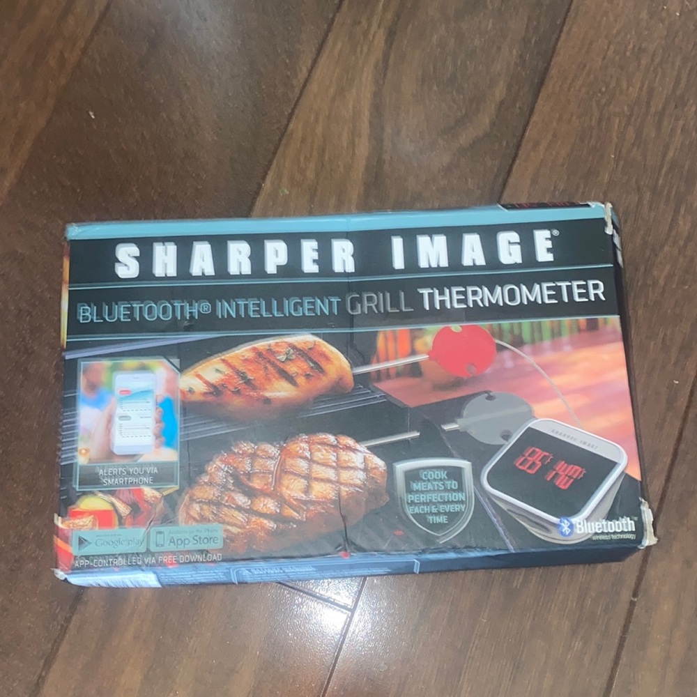 New in box sharper image Bluetooth intelligent grill thermometer. Box smashed